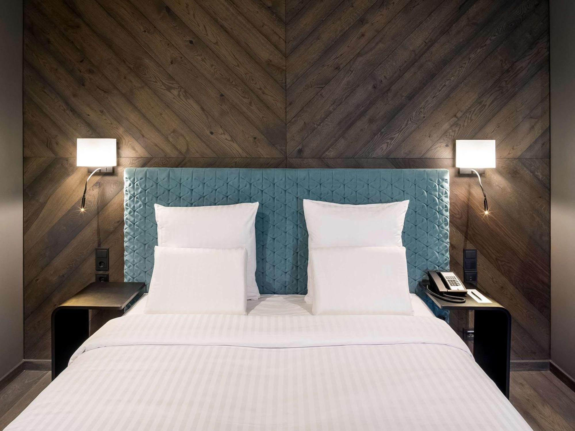 Pullman Riga Old Town Hotel Ngoại thất bức ảnh A bedroom at the hotel